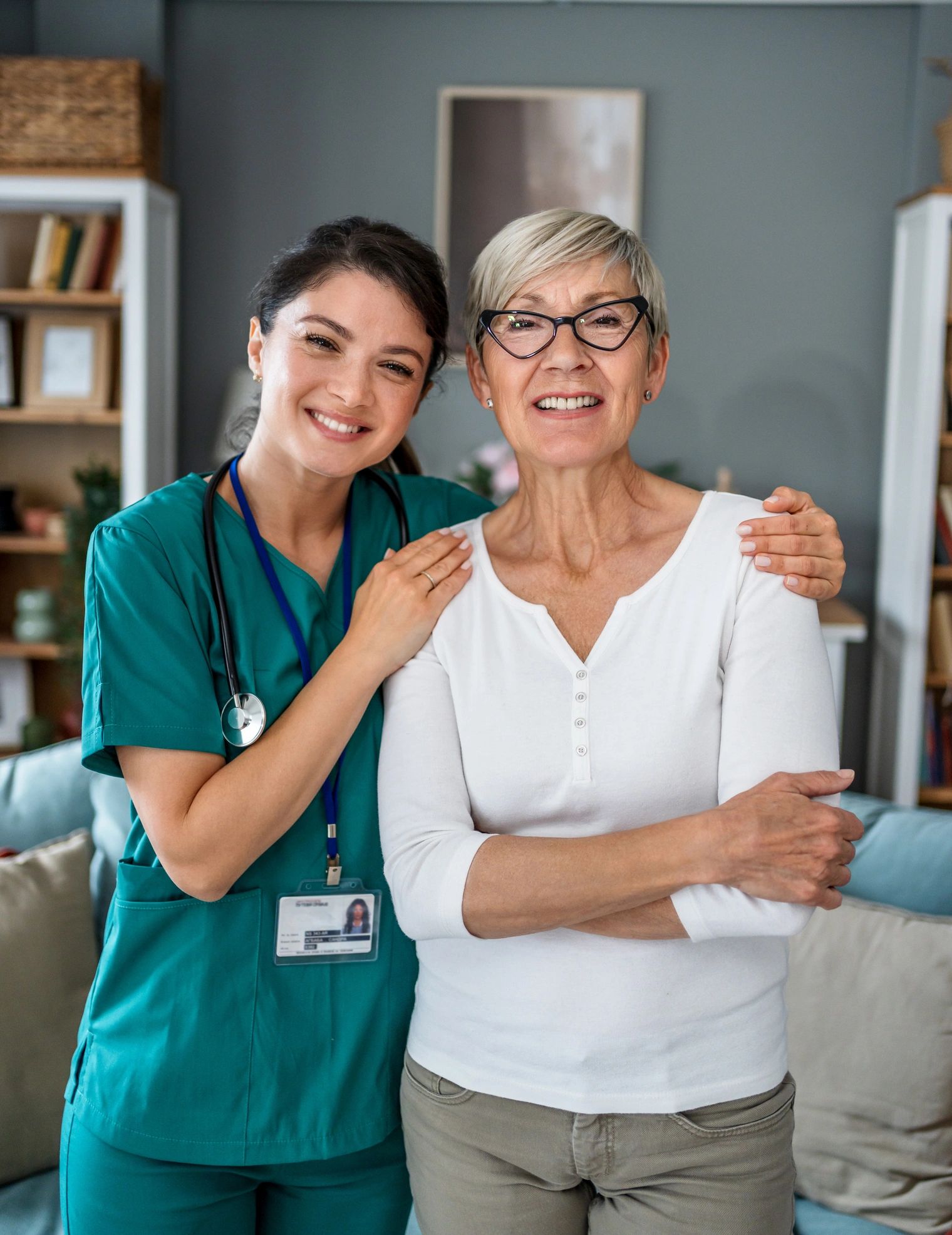 Caregiver and senior woman smiling together at home